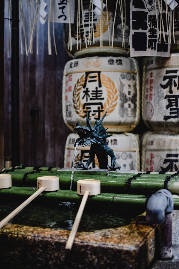 Kyoto's Shinto shrine with ceremonial water ladles and sake barrels reflecting Japanese culture.